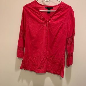 Pink shirt (comes off more as red on camera)